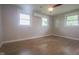 Bedroom features hardwood floors, modern lighting, and multiple windows providing natural light at 7302 N Banta Rd, Bargersville, IN 46106
