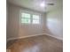 Bedroom featuring hardwood floors, ceiling fan, and natural light from the windows at 7302 N Banta Rd, Bargersville, IN 46106