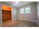 Bedroom featuring hardwood floors, closet, and natural light from the windows at 7302 N Banta Rd, Bargersville, IN 46106