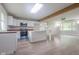 Bright kitchen featuring white cabinets, granite countertops, and a center island at 7302 N Banta Rd, Bargersville, IN 46106
