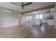 Bright, open floor plan showcasing hardwood floors, wooden beam, and a view to the kitchen at 7302 N Banta Rd, Bargersville, IN 46106
