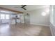 Open-concept living room featuring hardwood floors and an open view to the kitchen at 7302 N Banta Rd, Bargersville, IN 46106