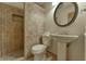 Bathroom with a shower, pedestal sink, and tiled floors at 770 Berkley Dr, Fortville, IN 46040