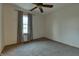Bright bedroom with carpeted floor and window with gray curtains at 770 Berkley Dr, Fortville, IN 46040