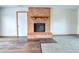 Brick fireplace in living room with wood flooring at 770 Berkley Dr, Fortville, IN 46040