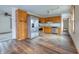Open kitchen with stainless steel appliances and wood cabinets at 770 Berkley Dr, Fortville, IN 46040