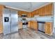 Kitchen with stainless steel appliances and wood cabinets at 770 Berkley Dr, Fortville, IN 46040
