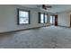 Bright living room with carpet flooring and ceiling fan at 770 Berkley Dr, Fortville, IN 46040