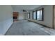 Spacious living room with carpet and brick fireplace at 770 Berkley Dr, Fortville, IN 46040
