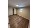 Bright bedroom with new flooring, fresh neutral paint, closet, and ample natural light at 10229 Baribeau Ln, Indianapolis, IN 46229