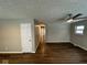 Bright hallway with new flooring leading into a large living room with neutral paint and overhead lighting at 10229 Baribeau Ln, Indianapolis, IN 46229