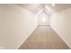 Bright attic space with carpet and natural light from octagon window at 1133 Olive St, Indianapolis, IN 46203