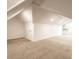 Spacious attic with neutral carpet, dormer, and a small storage area at 1133 Olive St, Indianapolis, IN 46203