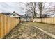 Fenced backyard with grass and patio at 1133 Olive St, Indianapolis, IN 46203