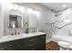 Elegant bathroom featuring double sinks, white marble countertops, brushed gold fixtures, and decorative mirrors at 1133 Olive St, Indianapolis, IN 46203