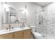 Modern bathroom featuring a double sink vanity with a marble shower at 1133 Olive St, Indianapolis, IN 46203