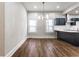 Dining area with lots of natural light, chandelier and wood-look floors at 1133 Olive St, Indianapolis, IN 46203