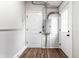 Hallway with white walls, wood floors and a door at 1133 Olive St, Indianapolis, IN 46203
