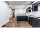 Open kitchen with stainless appliances, white countertops, and updated fixtures at 1133 Olive St, Indianapolis, IN 46203