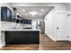 Updated kitchen with dark cabinetry, stainless steel appliances and white quartz countertops at 1133 Olive St, Indianapolis, IN 46203