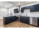 Kitchen with stainless appliances, white countertops, a subway tile backsplash and updated fixtures at 1133 Olive St, Indianapolis, IN 46203