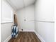 Bright laundry room with wood-look flooring, white walls and a window at 1133 Olive St, Indianapolis, IN 46203