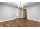An open-concept living room with hardwood floors and white trim throughout at 1133 Olive St, Indianapolis, IN 46203