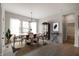 Contemporary dining room featuring an oval table, stylish chairs, and elegant decor at 19826 Chatham Shore Ln, Westfield, IN 46074