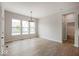Spacious dining area featuring bright natural light, elegant chandelier and hardwood style floors at 19826 Chatham Shore Ln, Westfield, IN 46074