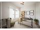 Bright home office with modern desk, chair, shelving and natural light at 19826 Chatham Shore Ln, Westfield, IN 46074