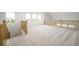 Loft area features carpet, natural light, and view of front of the property at 19995 Meadow Neck Rd, Westfield, IN 46074