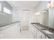 Modern main bathroom featuring double sinks, quartz countertop, large mirror, and glass shower at 19995 Meadow Neck Rd, Westfield, IN 46074