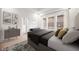 Bright bedroom with large windows, neutral decor, light hardwood floors, and modern furnishings at 20017 Old Dock Rd, Westfield, IN 46074