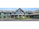 Beautiful clubhouse exterior with well manicured landscape featuring the American Flag at the entryway at 20017 Old Dock Rd, Westfield, IN 46074