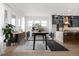 Bright dining area with modern decor, light wood flooring, and large windows for natural light at 20017 Old Dock Rd, Westfield, IN 46074
