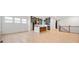 Open-concept layout with new floors and modern kitchen with gray cabinets and a large center island at 20017 Old Dock Rd, Westfield, IN 46074