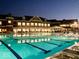 Outdoor swimming pool at night with clubhouse reflecting in the pristine water at 20017 Old Dock Rd, Westfield, IN 46074
