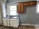 Traditional kitchen showcasing vintage cabinets and a stainless steel sink at 2029 Laurel St, Indianapolis, IN 46203
