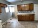 Kitchen features wood cabinets, laminate countertops, and linoleum flooring at 2029 Laurel St, Indianapolis, IN 46203
