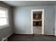 Open archway from living room to kitchen area with neutral carpet at 2029 Laurel St, Indianapolis, IN 46203