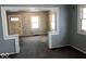 Open living room with a view of the front door and multiple windows at 2029 Laurel St, Indianapolis, IN 46203