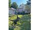 A spacious backyard with a detached garage and unique fence at 214 S Howard St, Oxford, IN 47971