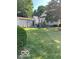 A spacious backyard with a detached garage and a lush green lawn at 214 S Howard St, Oxford, IN 47971