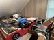 Fun bedroom design features a race car bed, natural light, and various decor at 214 S Howard St, Oxford, IN 47971