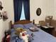 Comfortable bedroom with wooden accents and soft blue bedding at 214 S Howard St, Oxford, IN 47971
