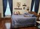 Comfortable bedroom with wooden accents and soft blue bedding at 214 S Howard St, Oxford, IN 47971