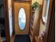 Inviting entryway featuring a decorative front door and a built-in bookshelf at 214 S Howard St, Oxford, IN 47971