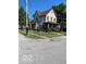 Charming two-story home with landscaped yard, front porch, and American flag at 214 S Howard St, Oxford, IN 47971