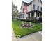 Charming two-story home with landscaped yard, front porch, and American flag at 214 S Howard St, Oxford, IN 47971
