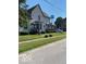 Two-story home with a manicured lawn and an inviting front porch at 214 S Howard St, Oxford, IN 47971